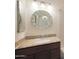 Bathroom boasts granite countertop, updated vanity, and oval mirror at 1207 W Sea Bass Ct, Gilbert, AZ 85233