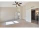 Large bedroom with access to bathroom and another room at 1207 W Sea Bass Ct, Gilbert, AZ 85233