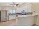 Modern kitchen with stainless steel appliances and white cabinetry at 1207 W Sea Bass Ct, Gilbert, AZ 85233