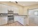 Updated kitchen featuring white cabinets and granite countertops at 1207 W Sea Bass Ct, Gilbert, AZ 85233