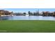 Expansive lakefront property with lush lawn and beautiful water views at 1207 W Sea Bass Ct, Gilbert, AZ 85233