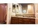 Spacious bathroom with double sinks and wood cabinets at 14335 W Monte Vista Rd, Goodyear, AZ 85395