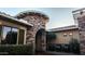 Inviting entryway with stone accents and a charming courtyard at 14335 W Monte Vista Rd, Goodyear, AZ 85395