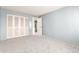 Bedroom with painted closet doors and wall-to-wall carpet at 14409 N 34Th Way, Phoenix, AZ 85032