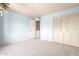 Spacious bedroom with built-in closet and carpeting at 14409 N 34Th Way, Phoenix, AZ 85032