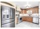 Stainless steel appliances and light wood cabinets in kitchen at 14409 N 34Th Way, Phoenix, AZ 85032