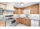 Updated kitchen with stainless steel appliances and wood cabinets at 14409 N 34Th Way, Phoenix, AZ 85032