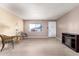 Living room with light wood floors and a fireplace at 14409 N 34Th Way, Phoenix, AZ 85032