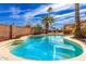 Relaxing kidney shaped pool surrounded by a large backyard at 14409 N 34Th Way, Phoenix, AZ 85032