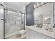 Modern bathroom with a large walk-in shower and marble tile at 15034 N 30Th St, Phoenix, AZ 85032