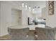 Kitchen island with seating overlooks the living room at 15034 N 30Th St, Phoenix, AZ 85032