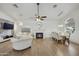 Living room features hardwood floors, fireplace, and sitting area at 15034 N 30Th St, Phoenix, AZ 85032