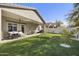 Relaxing covered patio with seating and grassy area at 15034 N 30Th St, Phoenix, AZ 85032