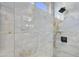 Walk-in shower with marble tile and a window for natural light at 15034 N 30Th St, Phoenix, AZ 85032