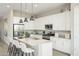 Modern kitchen with white cabinets, granite countertops, and a kitchen island at 15056 W Gray Fox Trl, Surprise, AZ 85387