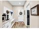 Mud room with built-in storage bench and coat hooks, conveniently located near the entryway at 15804 N 109Th Dr, Sun City, AZ 85351