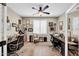 Home office space with dual desks, a ceiling fan, and natural light, perfect for productivity at 15804 N 109Th Dr, Sun City, AZ 85351