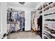 Spacious walk-in closet with built-in shelving and ample storage for shoes and clothing at 15804 N 109Th Dr, Sun City, AZ 85351