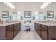 Elegant bathroom featuring double vanities, granite countertops and ample storage at 16247 S 180Th Dr, Goodyear, AZ 85338