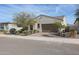 Single-story home with a two-car garage and desert landscaping at 16247 S 180Th Dr, Goodyear, AZ 85338