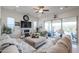 Bright living room with comfy seating, fireplace, and sliding glass doors leading to the backyard at 16247 S 180Th Dr, Goodyear, AZ 85338