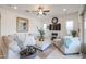 Spacious living room featuring a neutral color palette, plush seating and a large TV at 16247 S 180Th Dr, Goodyear, AZ 85338