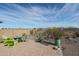 Relaxing patio area with seating and fire pit, perfect for outdoor entertaining at 16247 S 180Th Dr, Goodyear, AZ 85338