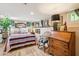 Basement bedroom featuring stylish furnishings, neutral walls, and hardwood floors at 1638 E Earll Dr, Phoenix, AZ 85016