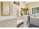 Elegant bathroom featuring tiled countertops, ample storage, and a bright window at 1638 E Earll Dr, Phoenix, AZ 85016