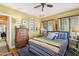 Charming bedroom featuring a vintage dresser, warm lighting, and decorative wall art at 1638 E Earll Dr, Phoenix, AZ 85016