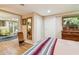 Well-lit bedroom featuring hardwood floors, closet space, and decorative accents at 1638 E Earll Dr, Phoenix, AZ 85016