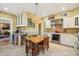 Spacious kitchen featuring stainless steel appliances, granite countertops, and a breakfast bar at 1638 E Earll Dr, Phoenix, AZ 85016