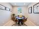 Small dining area with a dark wood table and four chairs at 16734 W Alameda Rd, Surprise, AZ 85387