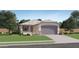 Single-story house with a two-car garage and landscaped front yard at 16734 W Alameda Rd, Surprise, AZ 85387