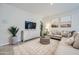 Living room with neutral-toned sectional sofa and wooden accent table at 16770 W Alameda Rd, Surprise, AZ 85387