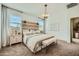 Main bedroom with wood plank accent wall and carpeted floors at 16770 W Alameda Rd, Surprise, AZ 85387