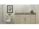 Clean bathroom with a vanity, toilet and framed art at 17593 W Victory St, Goodyear, AZ 85338