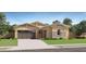 Single-story home with a brown garage door and stone accents at 17593 W Victory St, Goodyear, AZ 85338