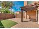 Private backyard with pergola and grass at 1777 S Balboa Dr, Gilbert, AZ 85295