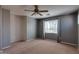 Bright bedroom with ceiling fan and window at 1777 S Balboa Dr, Gilbert, AZ 85295