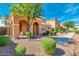 Two-story house with arched entryway and walkway, surrounded by neatly trimmed landscaping at 1777 S Balboa Dr, Gilbert, AZ 85295