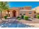 Two-story house with arched entryway, landscaped front yard, and neutral color scheme at 1777 S Balboa Dr, Gilbert, AZ 85295