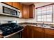 Kitchen features stainless steel appliances and wood cabinets at 1777 S Balboa Dr, Gilbert, AZ 85295