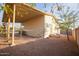 House exterior with covered patio and gravel yard at 180 S Stardust Ln, Apache Junction, AZ 85120