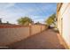 Side yard with block wall and gravel landscaping at 180 S Stardust Ln, Apache Junction, AZ 85120