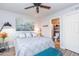 Bright bedroom with ceiling fan and ensuite bath at 180 S Stardust Ln, Apache Junction, AZ 85120