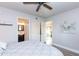 Comfortable bedroom with ceiling fan and access to bath at 180 S Stardust Ln, Apache Junction, AZ 85120