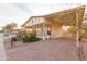 Front view of house with covered carport and porch at 180 S Stardust Ln, Apache Junction, AZ 85120