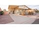 House exterior with covered carport and landscaping at 180 S Stardust Ln, Apache Junction, AZ 85120