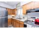 Modern kitchen with stainless steel range and wood cabinetry at 180 S Stardust Ln, Apache Junction, AZ 85120